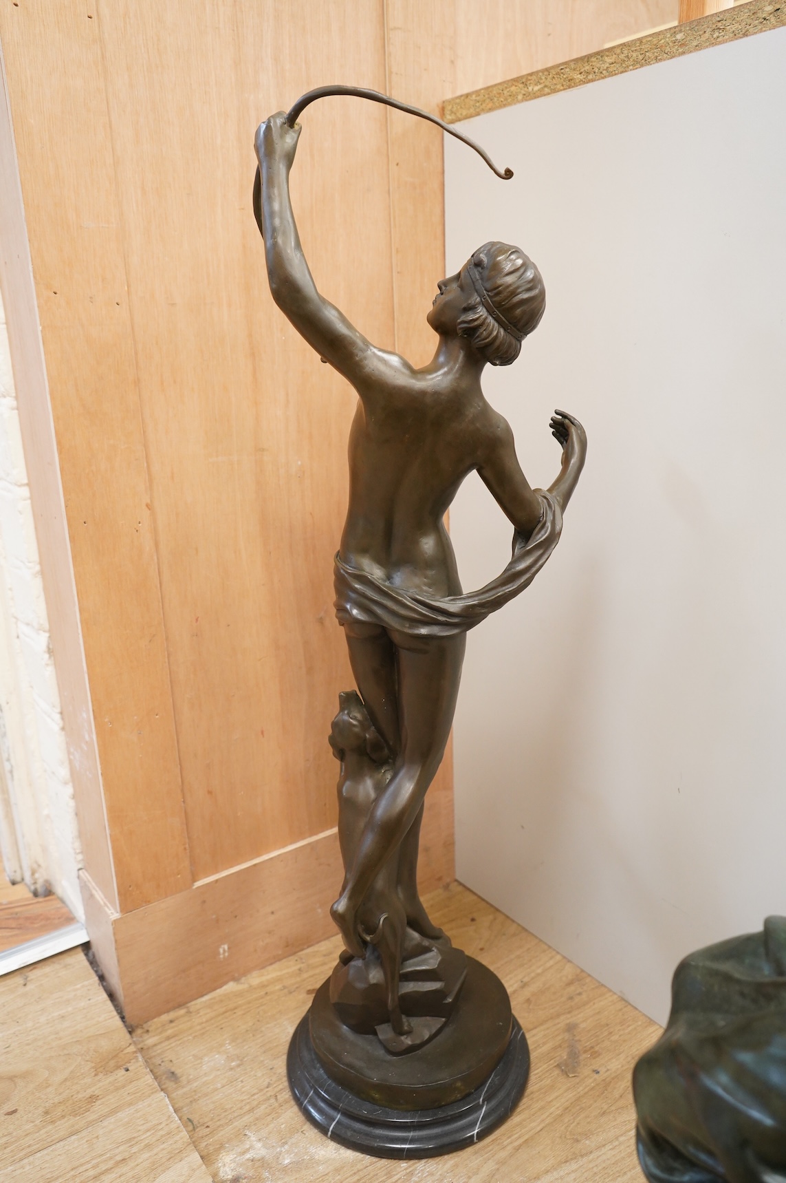 A large Art Deco style patinated bronze figure of Diana, unsigned on black marble base, height 85cm
